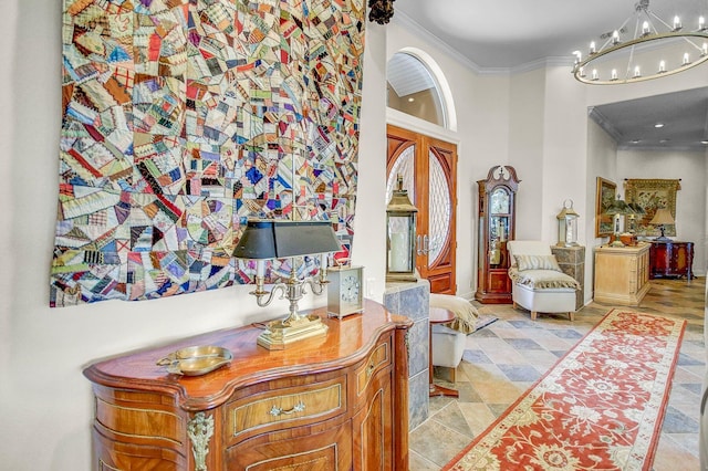 hall featuring an inviting chandelier, light tile patterned floors, and crown molding