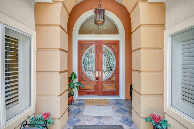 view of exterior entry featuring french doors