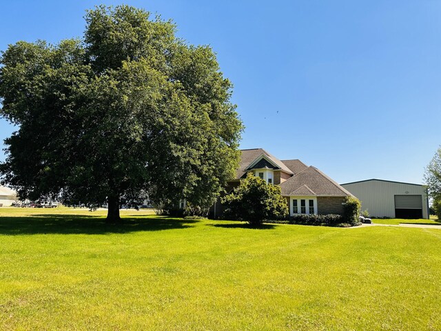 view of yard with a garage