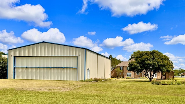 view of outdoor structure with a yard