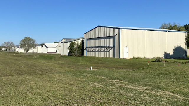 view of outdoor structure with a yard