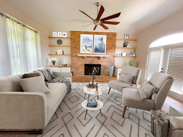 living room featuring a brick fireplace and ceiling fan