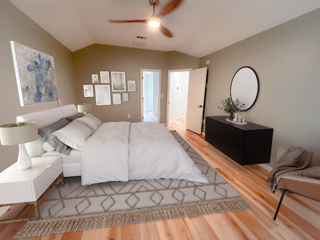 bedroom featuring vaulted ceiling, ceiling fan, and light wood-type flooring