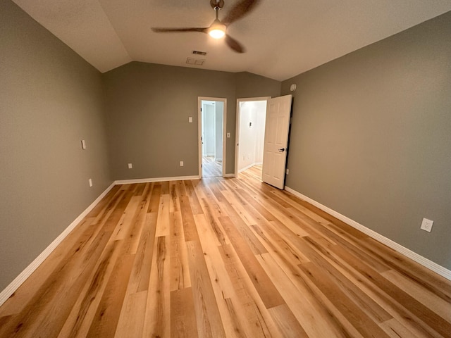 unfurnished bedroom with vaulted ceiling, ceiling fan, and light hardwood / wood-style floors