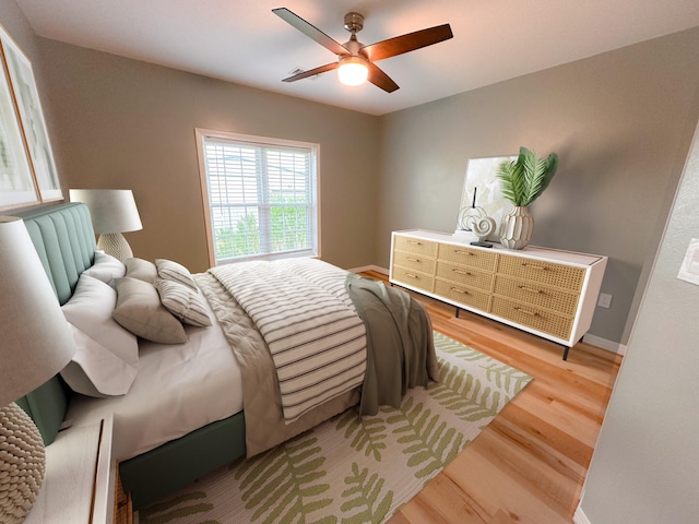 bedroom featuring ceiling fan and light hardwood / wood-style flooring