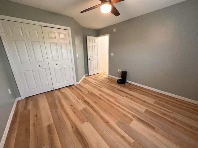 unfurnished bedroom with a closet, ceiling fan, and light hardwood / wood-style flooring