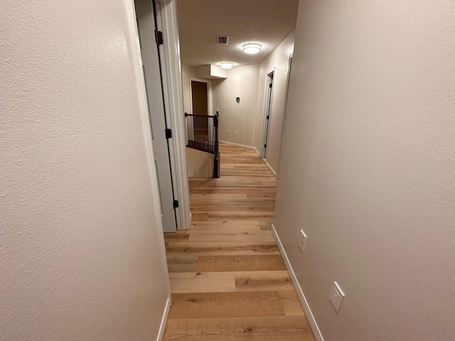 hallway featuring light wood-type flooring