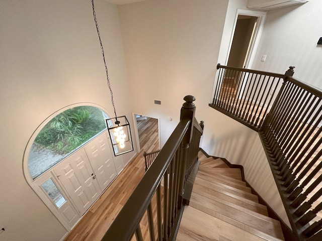 staircase featuring wood-type flooring