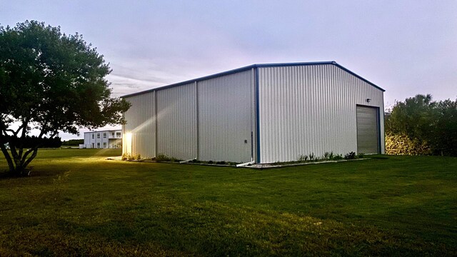 view of outbuilding with a lawn