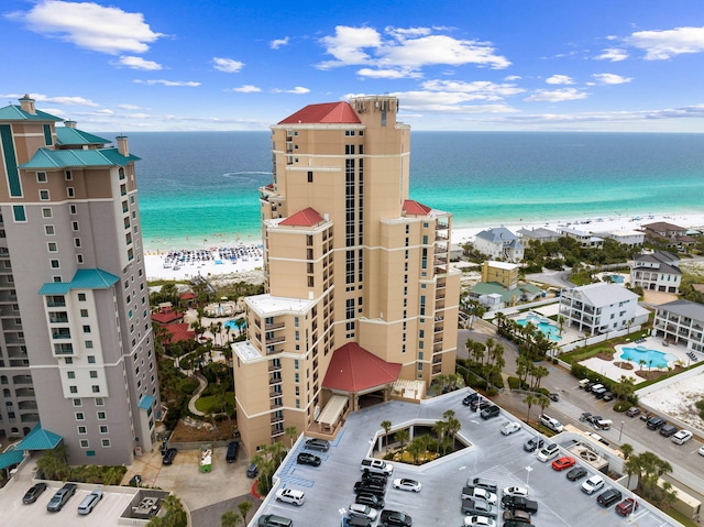 birds eye view of property featuring a view of the beach and a water view