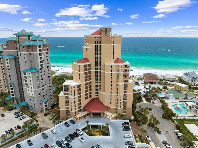 birds eye view of property featuring a water view and a view of the beach