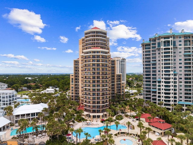 view of building exterior featuring a community pool