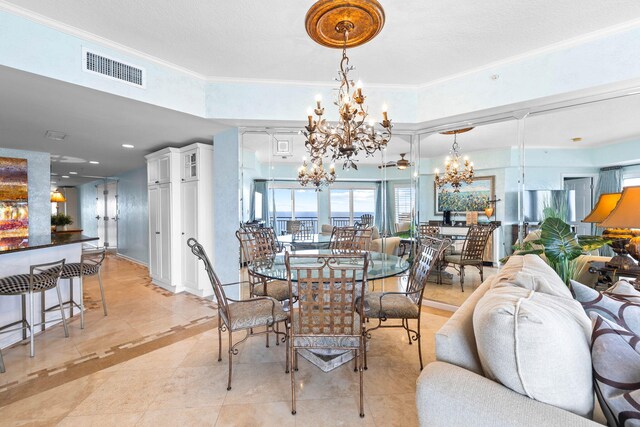 dining area featuring a notable chandelier and ornamental molding