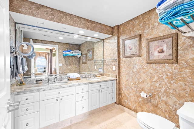 bathroom with vanity, tile patterned floors, and toilet