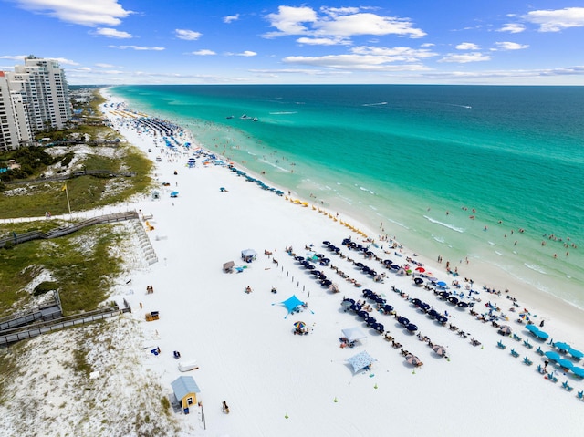 bird's eye view featuring a view of the beach and a water view