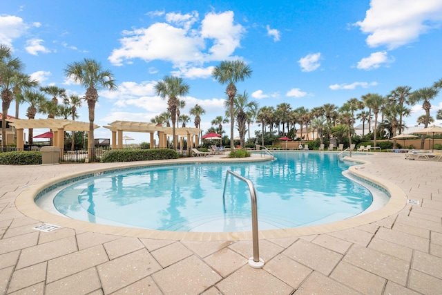 view of pool featuring a pergola and a patio