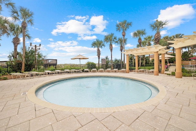 view of swimming pool with a pergola and a patio area