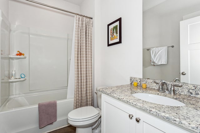 full bathroom with vanity, shower / tub combo with curtain, and toilet