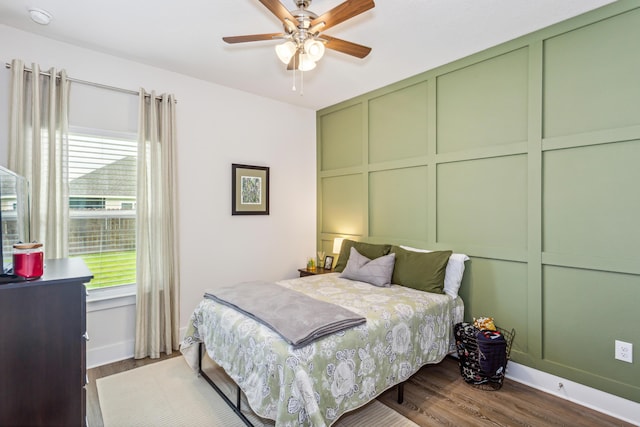 bedroom featuring ceiling fan and dark hardwood / wood-style floors