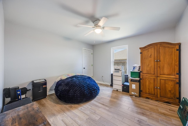 misc room with ceiling fan and light hardwood / wood-style floors