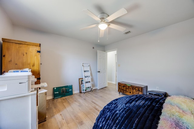 bedroom with ceiling fan and light hardwood / wood-style flooring