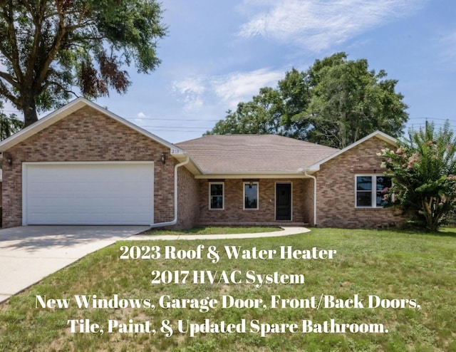 ranch-style home with a front yard and a garage