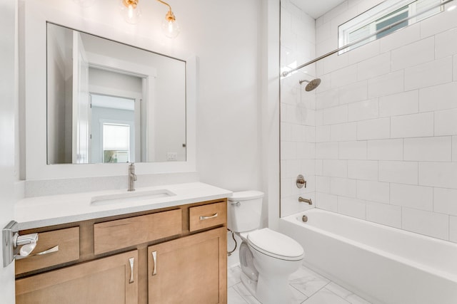 bathroom with washtub / shower combination, marble finish floor, vanity, and toilet