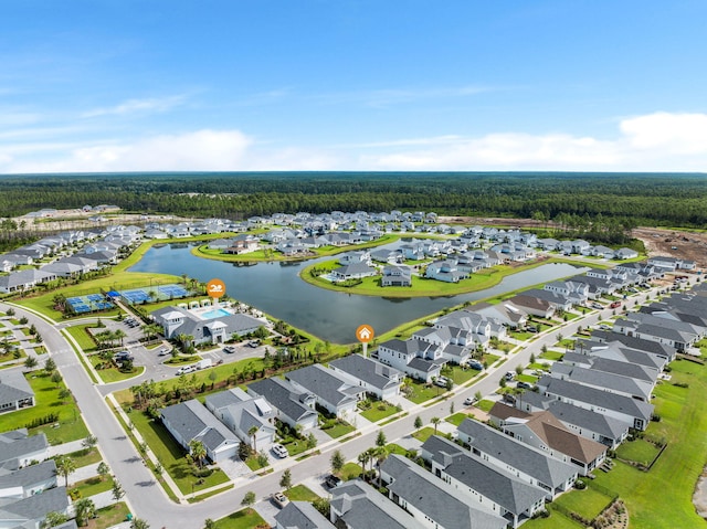 drone / aerial view featuring a water view and a residential view