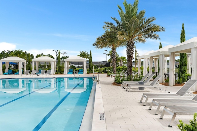 pool featuring a patio area and a gazebo