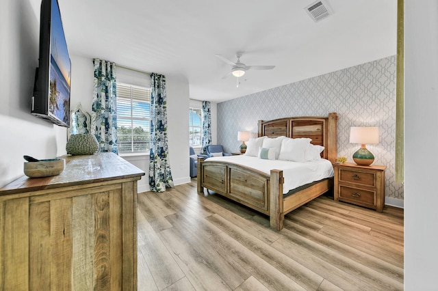 bedroom featuring light hardwood / wood-style flooring and ceiling fan