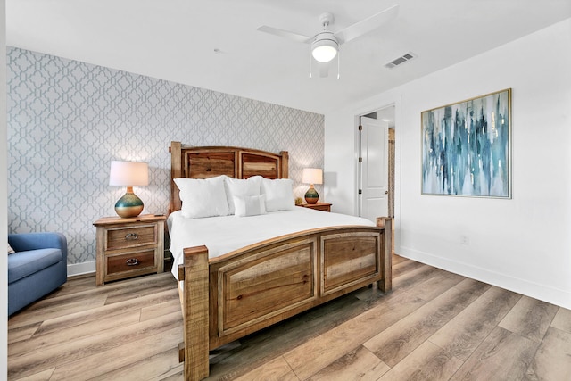 bedroom with ceiling fan and light wood-type flooring