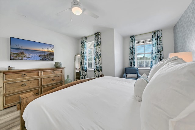 bedroom featuring light hardwood / wood-style floors and ceiling fan