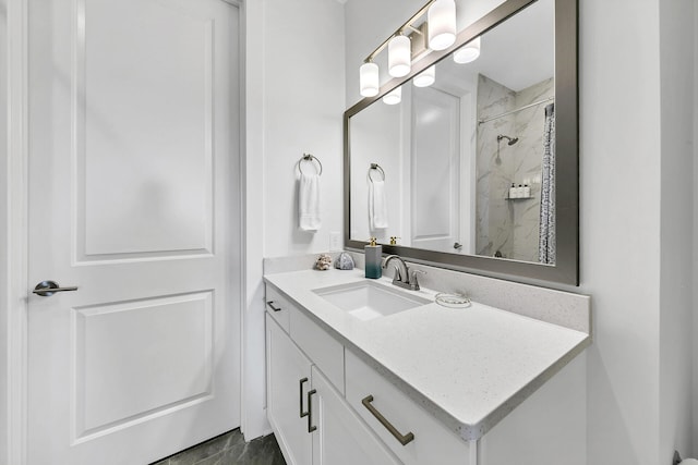 bathroom featuring vanity and a shower