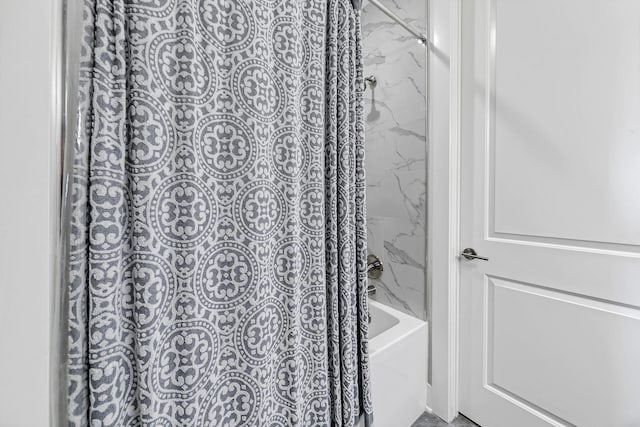 bathroom featuring shower / bath combo with shower curtain