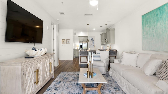 living room with dark hardwood / wood-style flooring