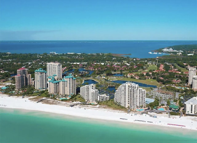 drone / aerial view with a water view and a beach view