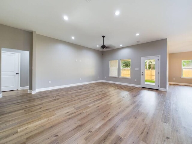 unfurnished living room featuring light hardwood / wood-style flooring