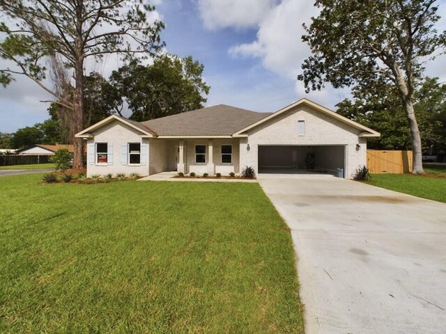 ranch-style house with a front lawn and a garage