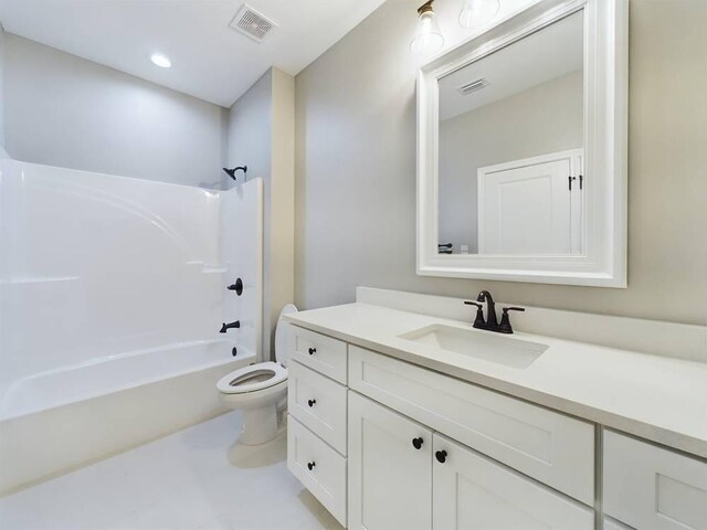 full bathroom featuring toilet, tub / shower combination, vanity, and tile patterned floors