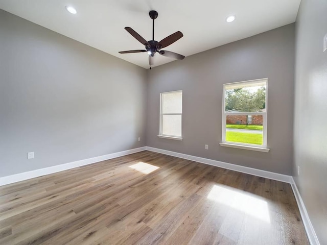 spare room featuring ceiling fan, baseboards, wood finished floors, and recessed lighting