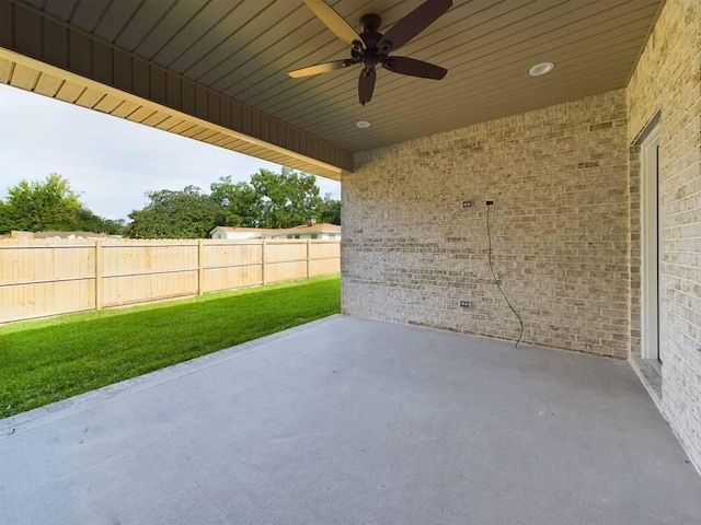 view of patio featuring fence and a ceiling fan