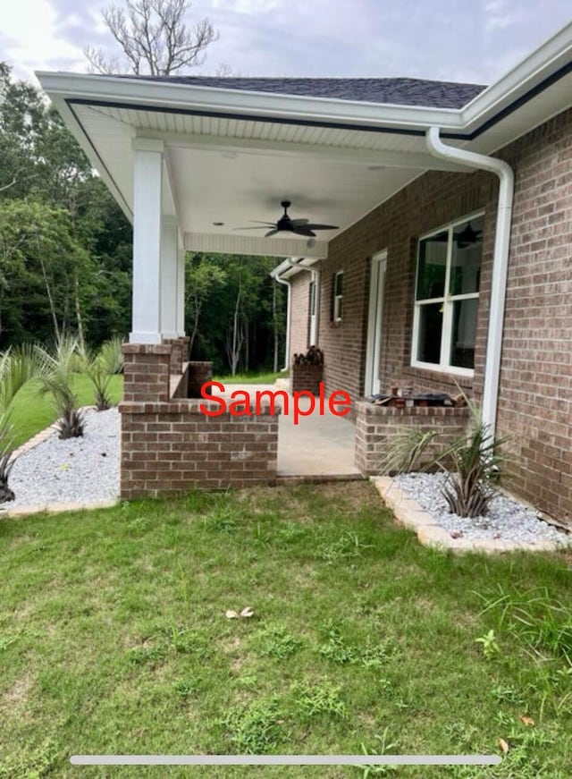 view of yard with ceiling fan