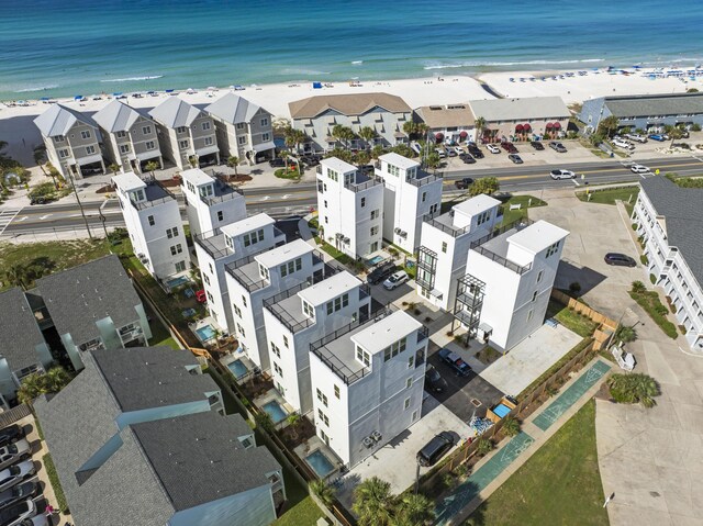 bird's eye view with a view of the beach and a water view