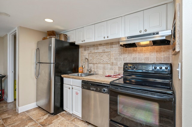 kitchen with tasteful backsplash, appliances with stainless steel finishes, sink, and white cabinetry