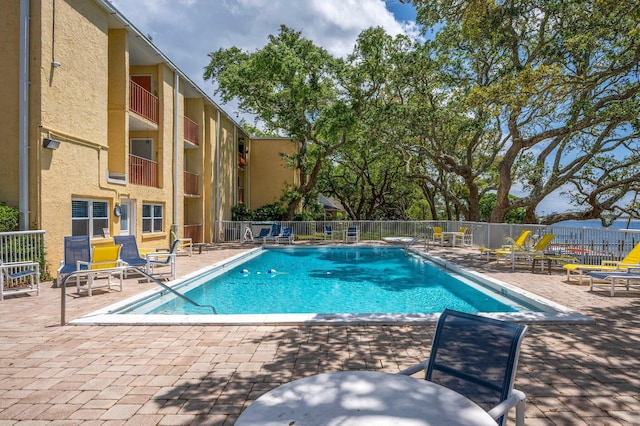 view of swimming pool featuring a patio