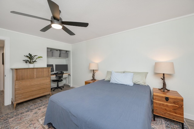 bedroom with ceiling fan, ornamental molding, and hardwood / wood-style flooring