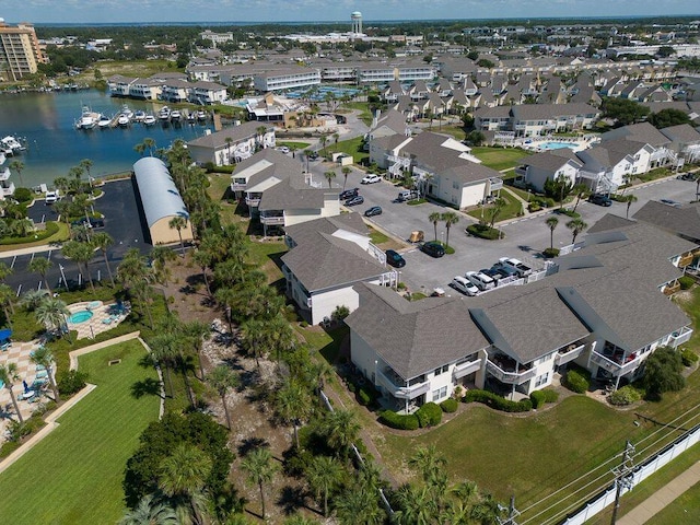 birds eye view of property with a water view