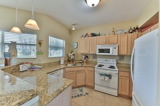 kitchen featuring white appliances, decorative light fixtures, light brown cabinetry, and sink