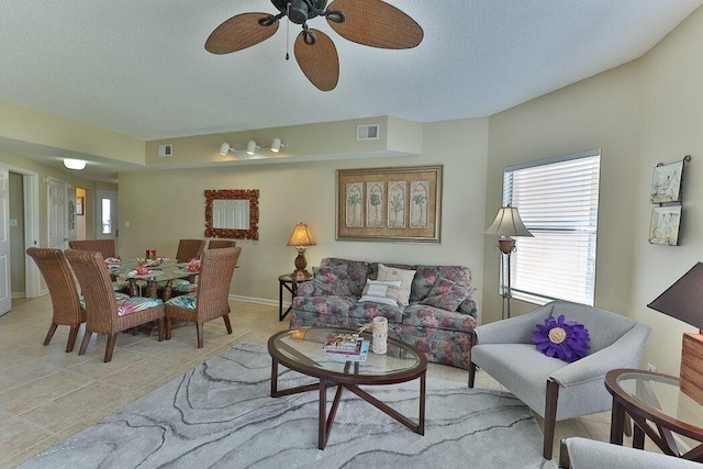 tiled living room with a textured ceiling