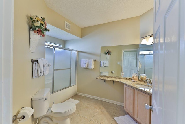 full bathroom with shower / bath combination with glass door, vanity, a textured ceiling, tile patterned floors, and toilet